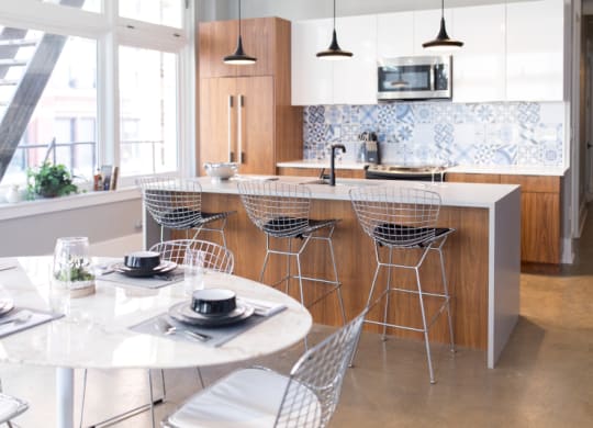 Kitchen with a Large Island and Dining Table at Fourteen56, Detroit, MI