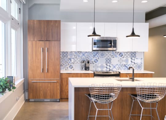 Kitchen with Wooden Cabinets and Island at Fourteen56, Detroit, MI
