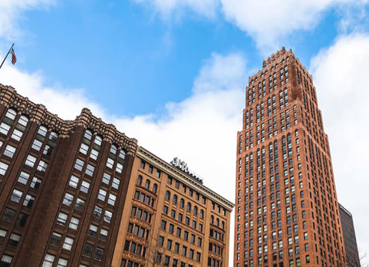 Street view of The Stott with blue skies and white clouds.