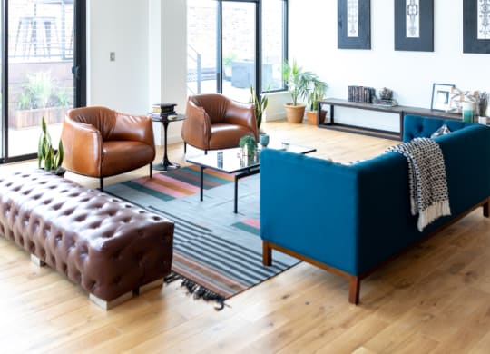 Seating Area With Blue and Brown Chairs at The Assembly, Detroit, MI