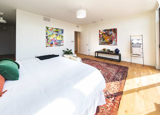 Bedroom with White Walls and Large Carpet at The Assembly, Detroit, MI