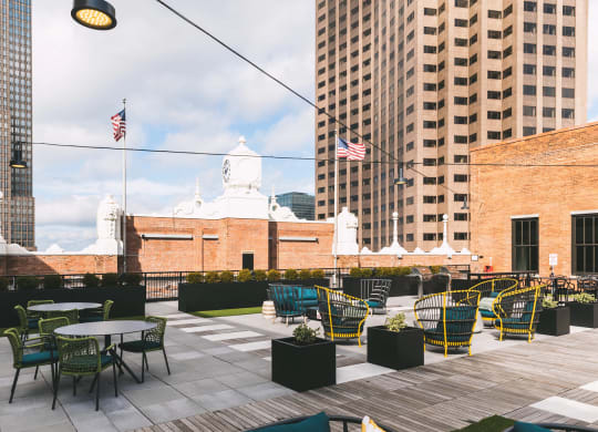 Residential rooftop lounge with a variety of seating and a view of downtown Cleveland.