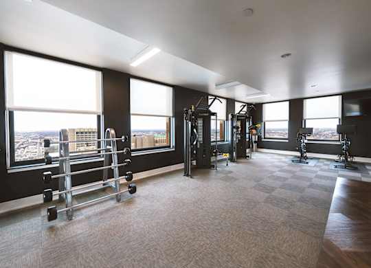 The gym at The Stott with a view of the city.