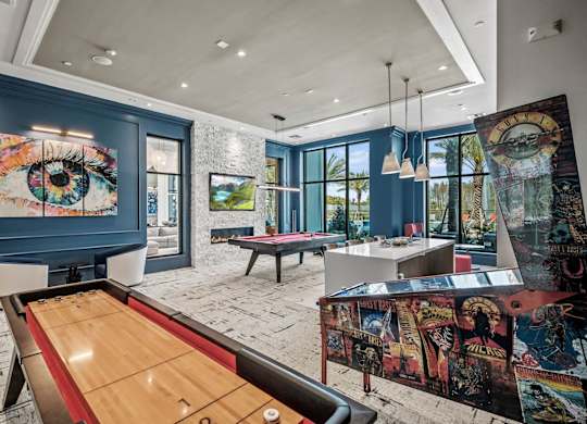 a game room with a pool table and a painting on the wall at Altis Twin Lakes Apartments, Florida