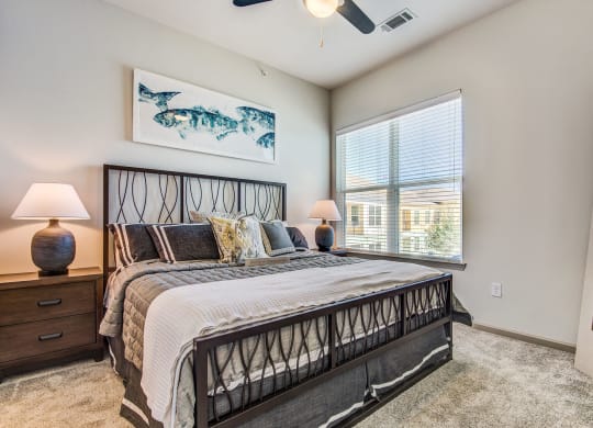 Apartments In Lewisville, TX - Hebron 121 Station - Spacious Bedroom With Premium Carpeting, Ceiling Fan, And Window For Natural Sunlight