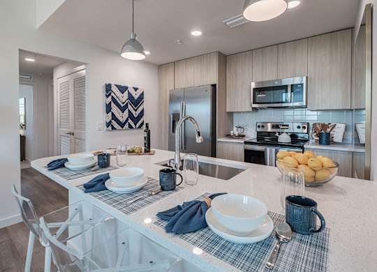 a kitchen with a counter top and a sink at Altis Santa Barbara, Florida