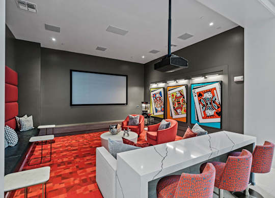 a conference room with a white table and chairs and a television at Altis Twin Lakes Apartments, Kissimmee, 34744