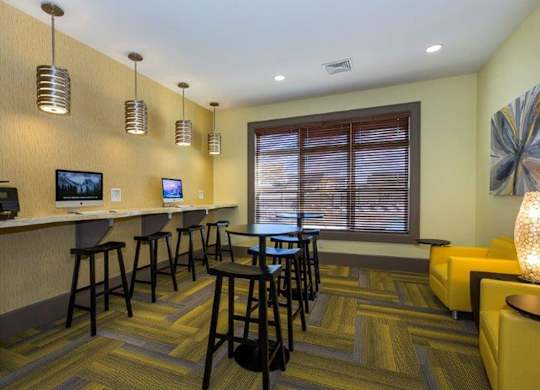 A room with a bar area and a couch.