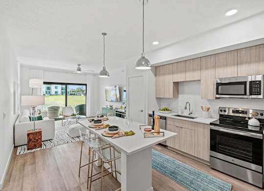 A modern kitchen with a dining table and chairs.