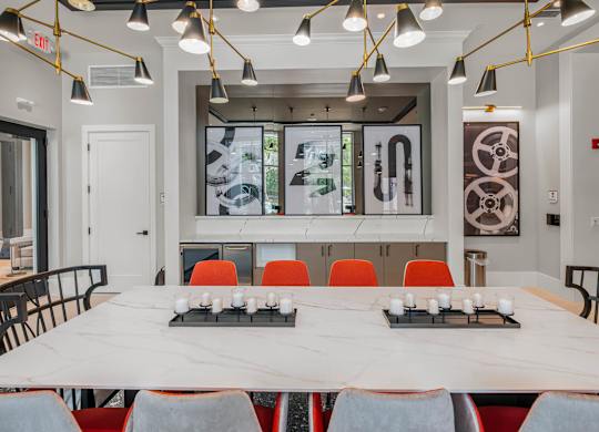 A conference room with a long table and chairs.
