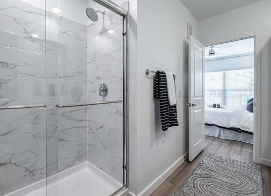 a bathroom with a shower at Altis Grand Suncoast, Land O' Lakes