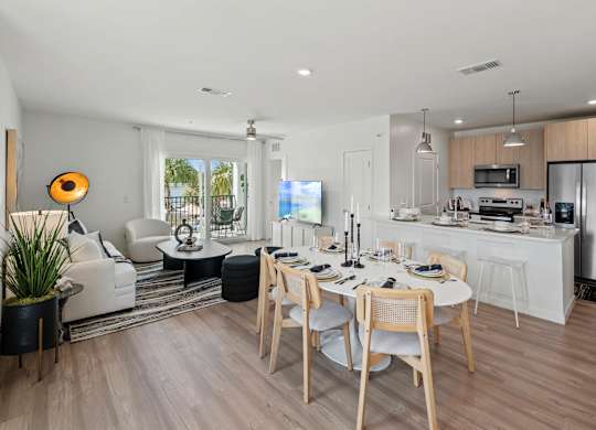 a kitchen and dining room with a table and chairsat Altis Grand Suncoast, Land O' Lakes Florida