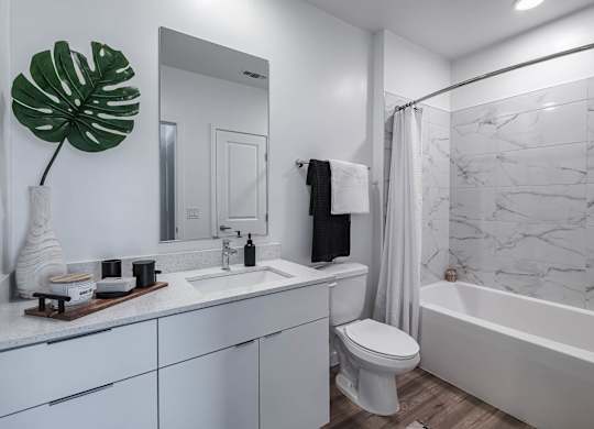a bathroom with a sink toilet and a shower at Altis Grand Suncoast, Florida