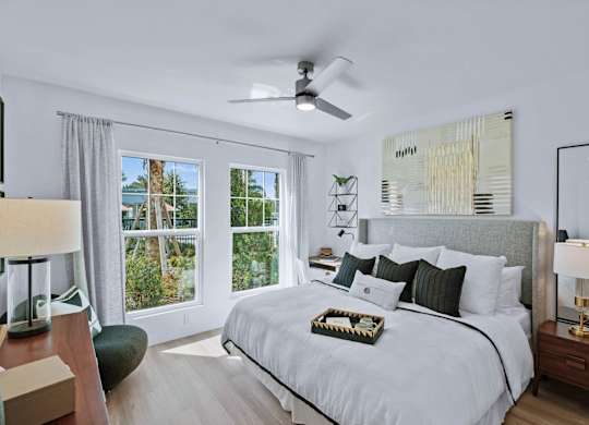 a bedroom with a large bed and a ceiling fan at Altis Twin Lakes Apartments, Florida, 34744