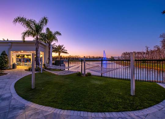 A house with a palm tree in front of it.