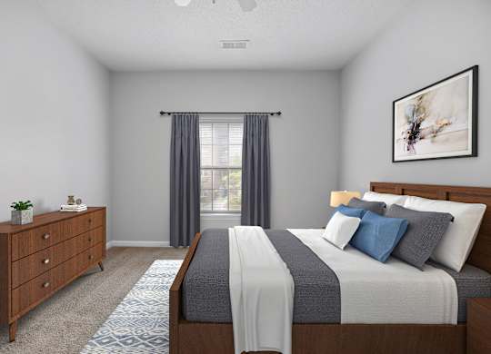 A bedroom with a large bed and a dresser.