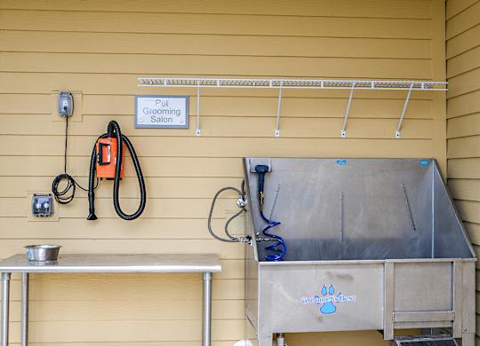 A grooming station with a sign that says