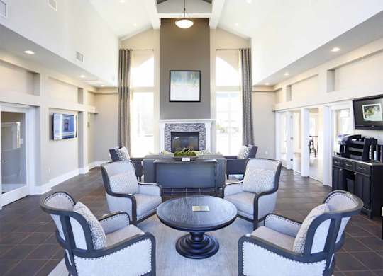 A living room with a fireplace and a television.
