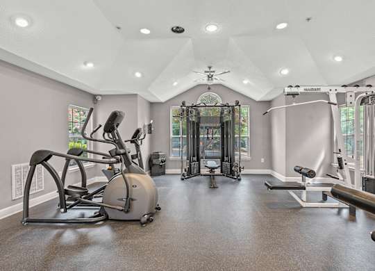 A spacious home gym with a variety of exercise equipment.