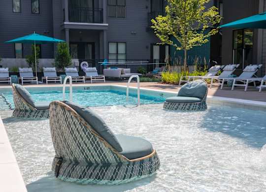 A pool with a chair in the middle of it.