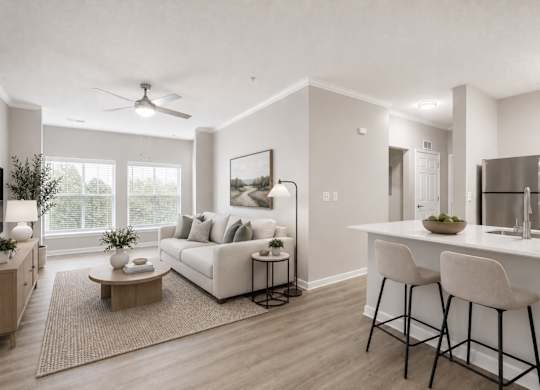 A modern living room with a white sofa, a coffee table, and a bar area with stools.