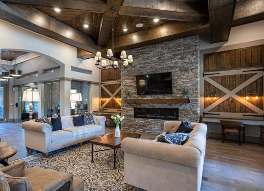 a living room with couches and a fireplace