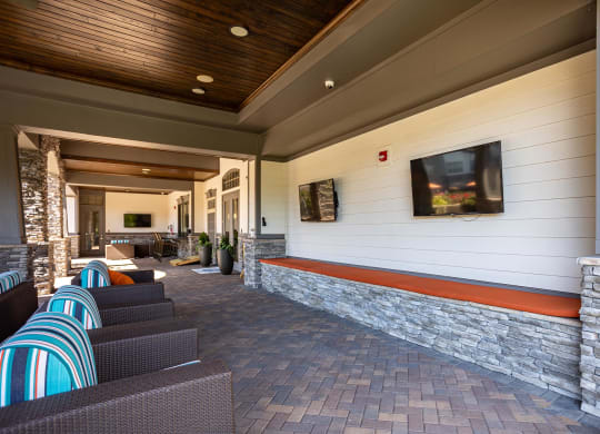 a lobby with couches and a television on the wall
