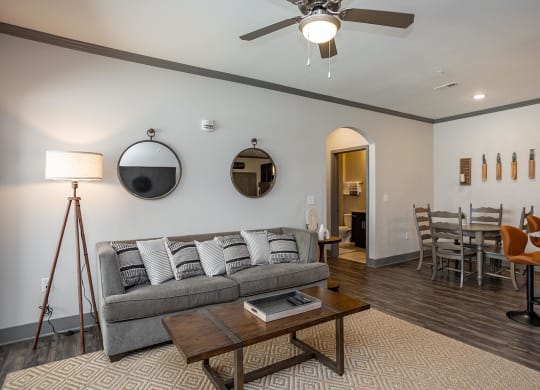 a living room and dining room with a couch and a table