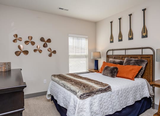 a bedroom with a bed and a desk