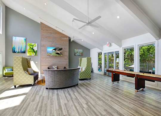 A modern living room with a wooden floor and a large window.