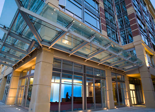 A modern building with a glass and steel structure.