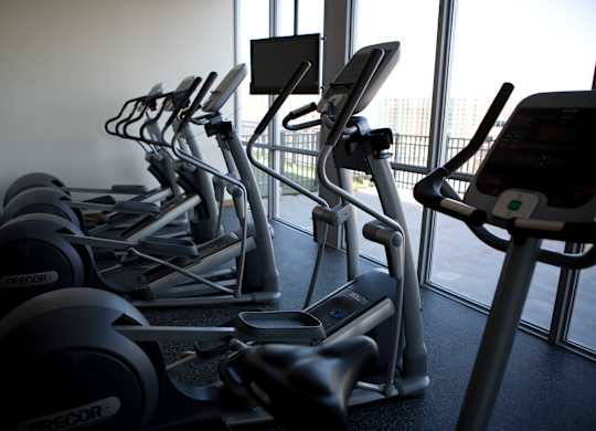 A row of treadmills in a gym.