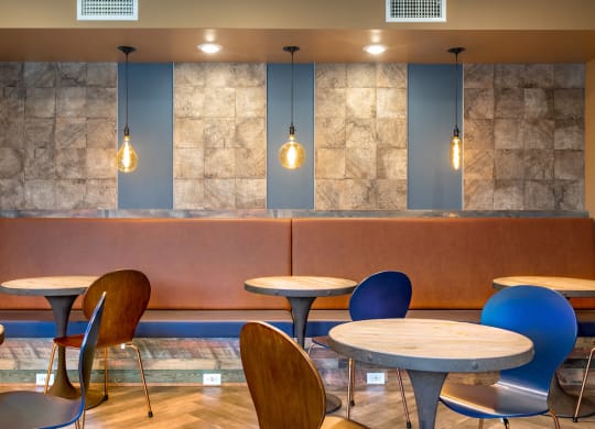 a seating area with tables and chairs