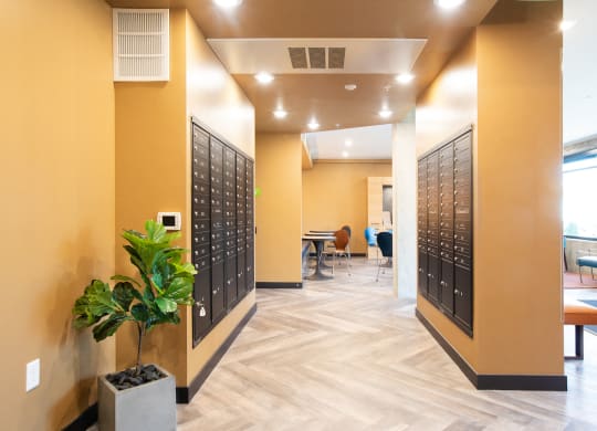a photo of the inside of a building with yellow walls and lockers