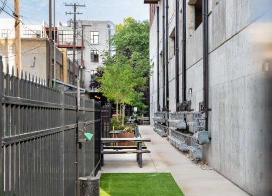 a small patch of grass in front of a building