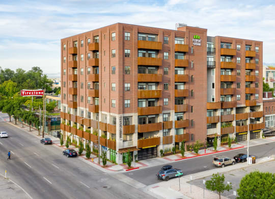 an aerial view of a brick apartment building with balconies
