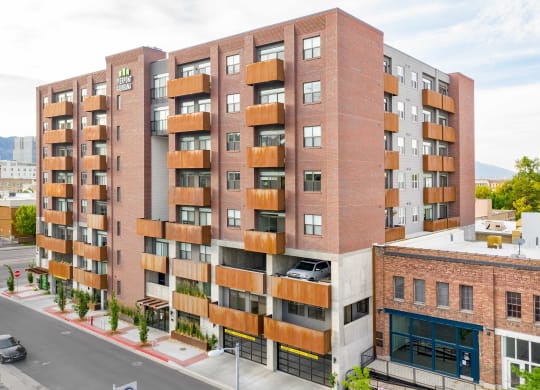 a red brick apartment building with wooden balconies
