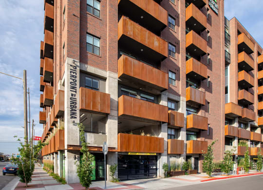 an image of the front of the building with trees in front of it