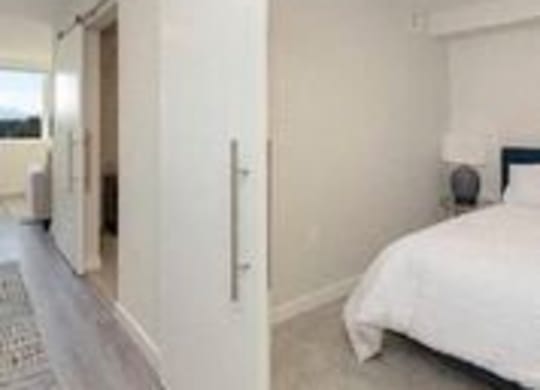 Cozy Bedroom with Sliding Barn Style Doors at Arabella Apartment Homes, Shoreline, WA