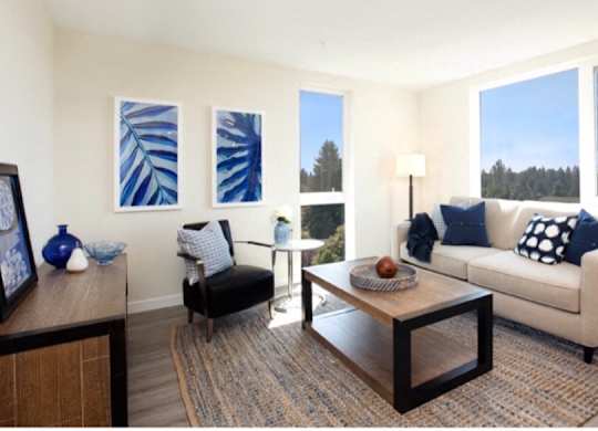 Living Room with plank flooring, spacious living room rug, and large floor-to-ceiling living room windows at Arabella Apartment Homes, Shoreline, 98155