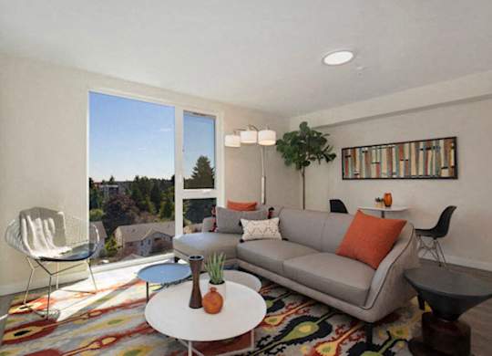Large Open Spaced Living Room with floor to ceiling windows letting in natural light at Arabella Apartment Homes, Shoreline, Washington