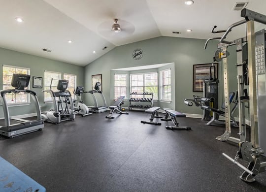 fitness center with treadmills and strength equipment