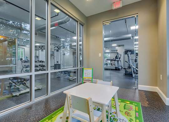 a table and chairs in a room with glass doors