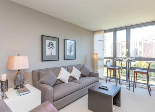 a living room with a couch and a coffee table at The Millennium, Arlington