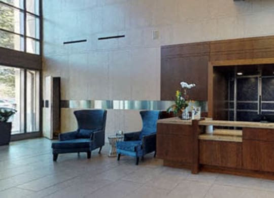 a lobby with a reception desk and chairs at The Millennium, Virginia