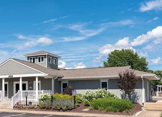 clubhouse and leasing office building with sidewalk