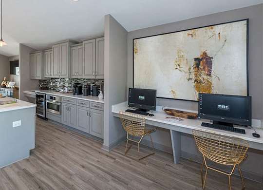 clubroom kitchenette area with gray cabinets and appliances