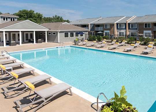 outdoor swimming pool with lounge chairs