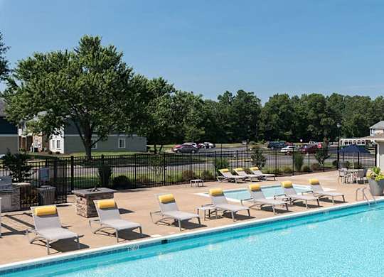 outdoor swimming pool with lounge chairs