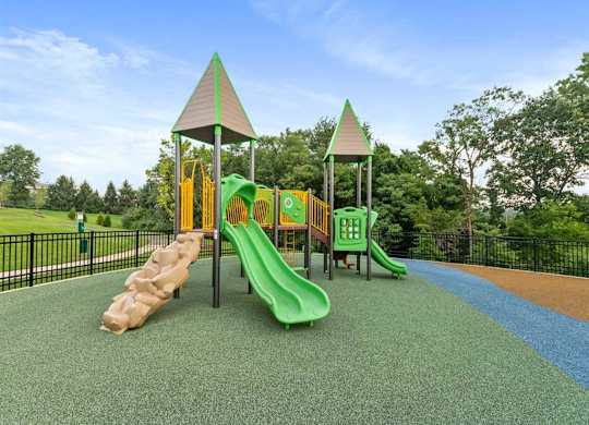 a playground with slides and other toys in a park
